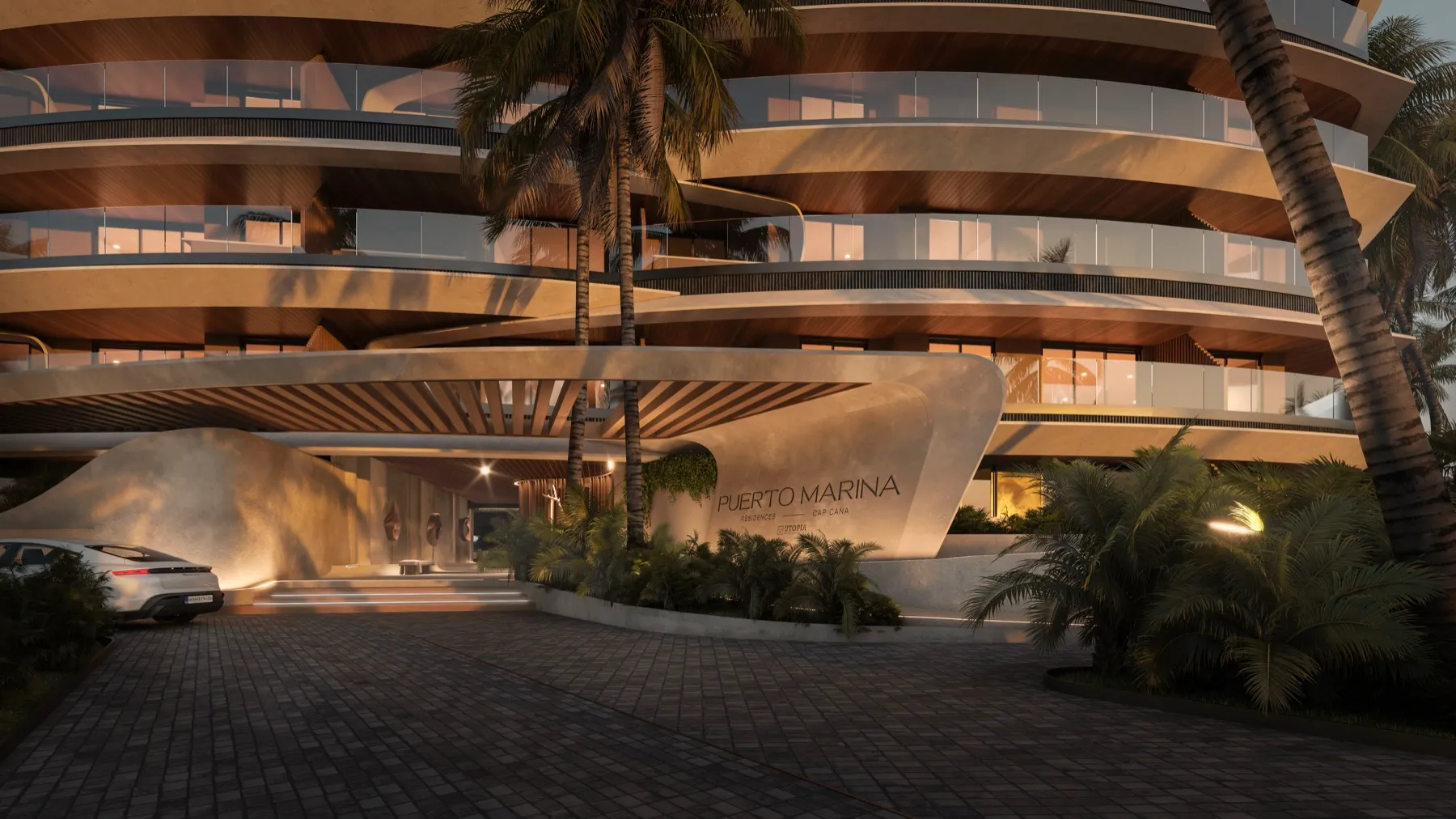 Puerto Marina Residences — acceso principal nocturno